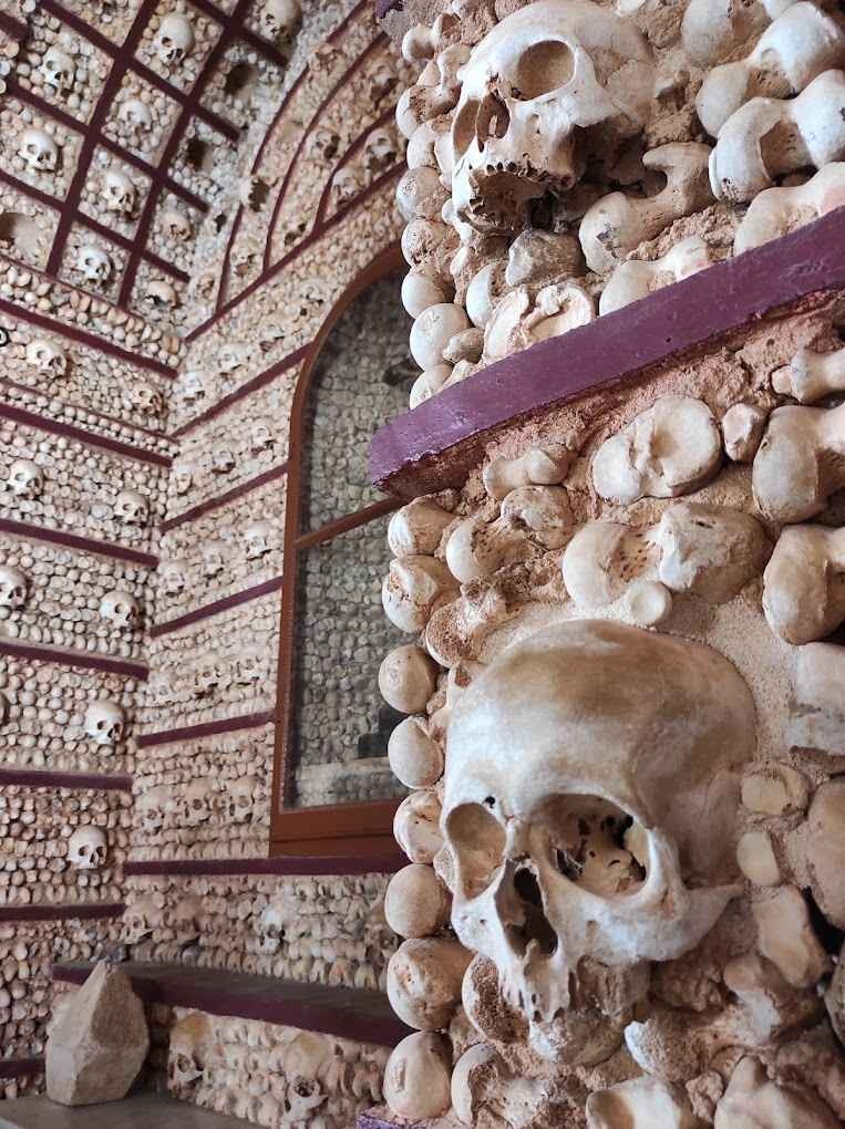 The neoclassical-inspired interior of Faro’s Bone Chapel, featuring skeletal decorations