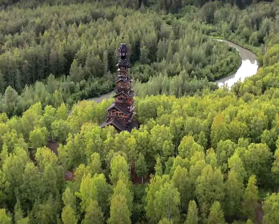 The quirky Goose Creek Tower amidst Alaskan trees