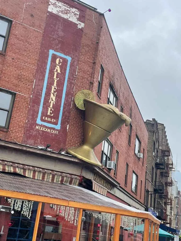 Vibrant frozen margarita sculpture outside Caliente Cab Co