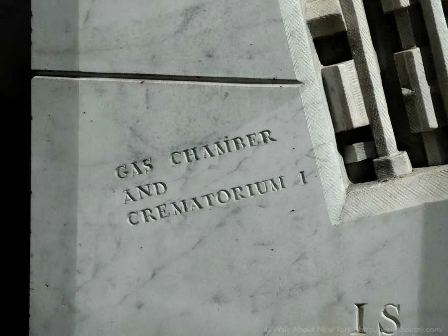 Flames sculpted on the column symbolize the gas chambers