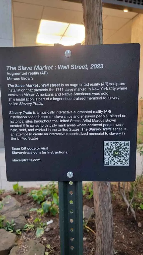 A historical plaque in Lower Manhattan commemorating the city's former slave market.