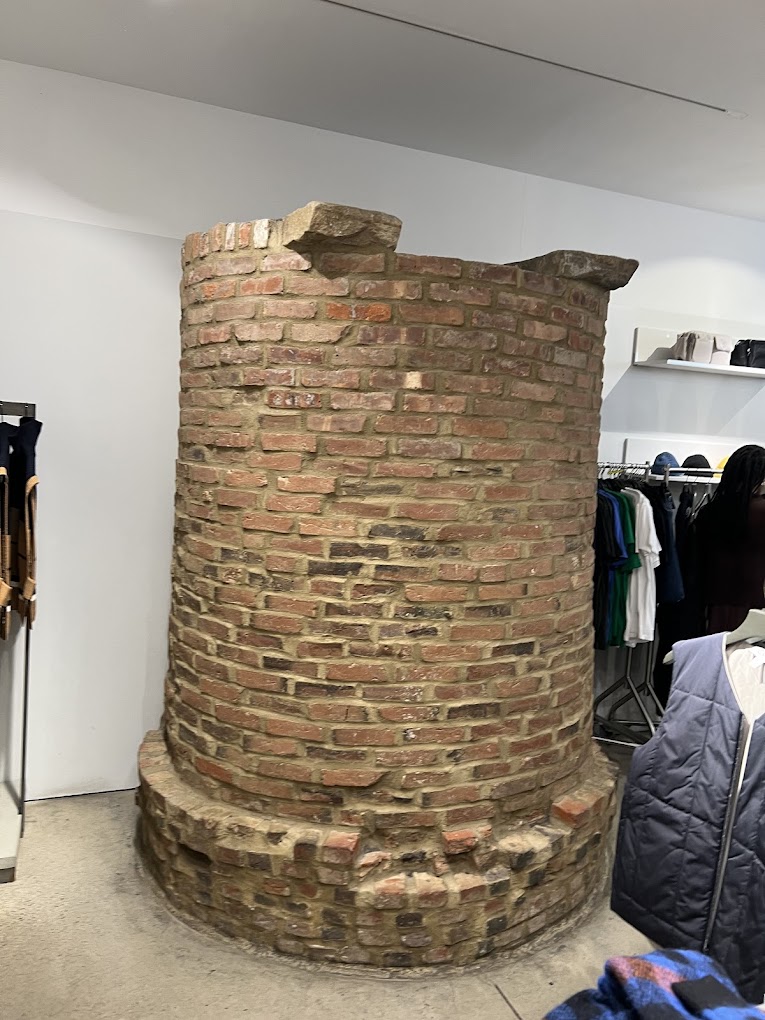 200-year-old red brick well in a clothe store