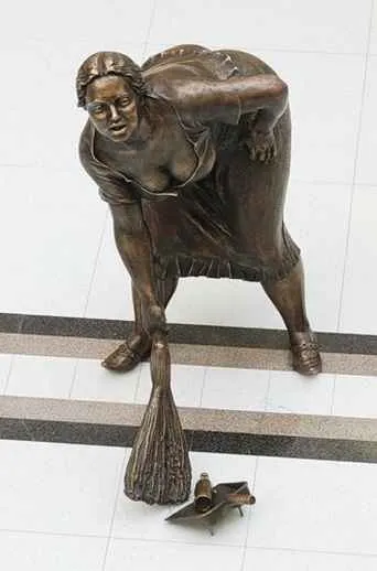 Original sculpture of The Cleaning Lady with the dustpan and bottle