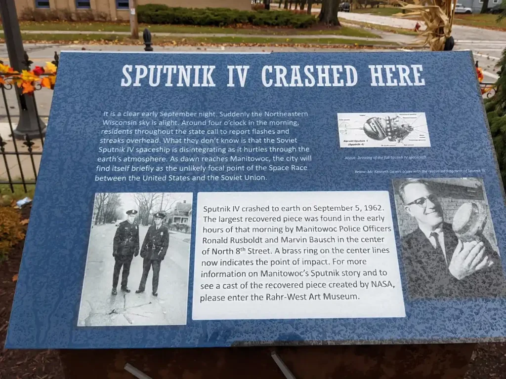 Sign with the satellite story in Manitowoc