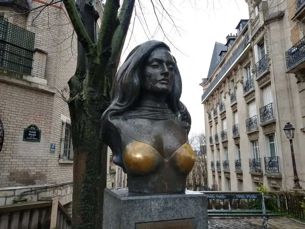 Dalida statue in Paris, visibly polished on the chest from constant visitor contact.