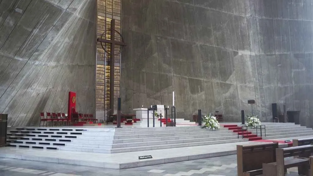 Interior of Tokyo Cathedral, vast concrete space.