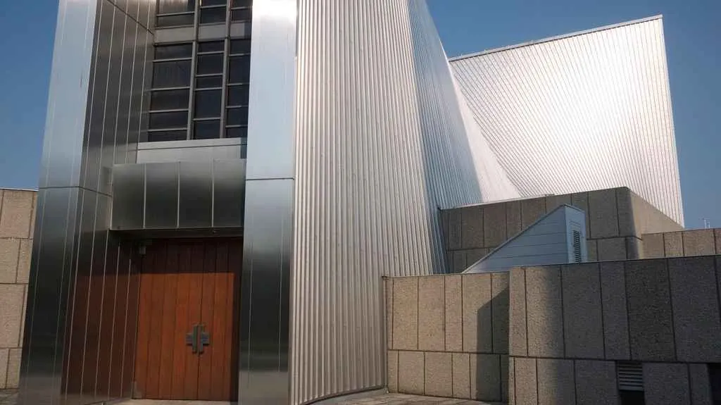 A simple wooden door marks the main entrance to Tokyo Cathedral.