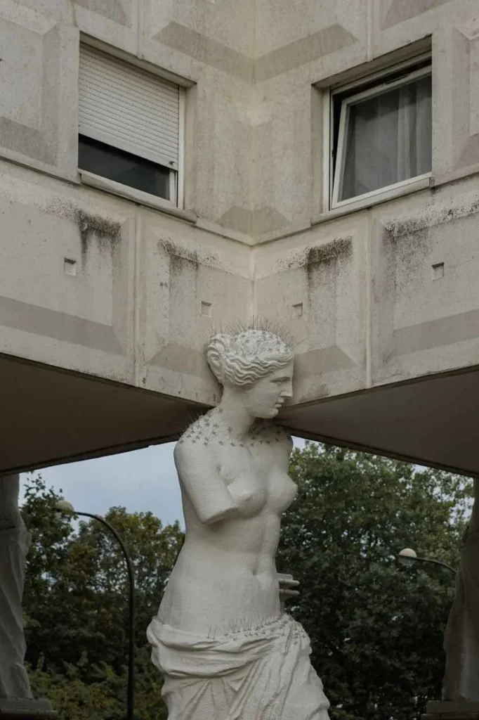 Caryatids gazing over the urban square