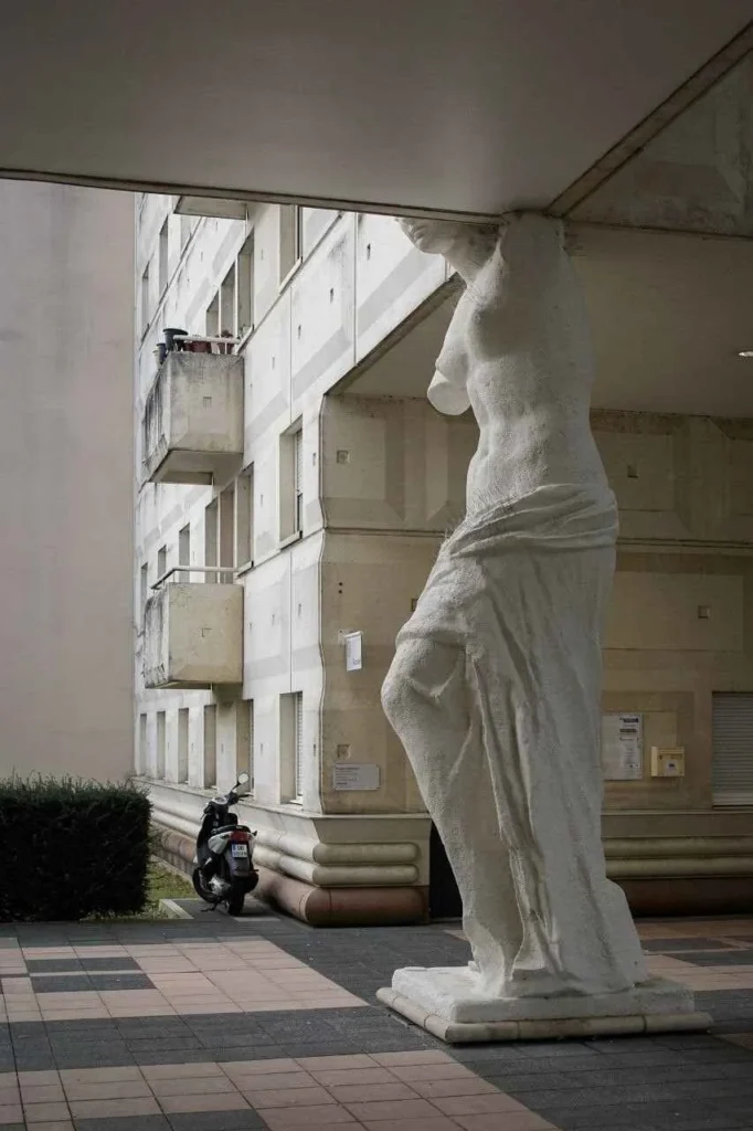 Close-up of a caryatid holding a balcony